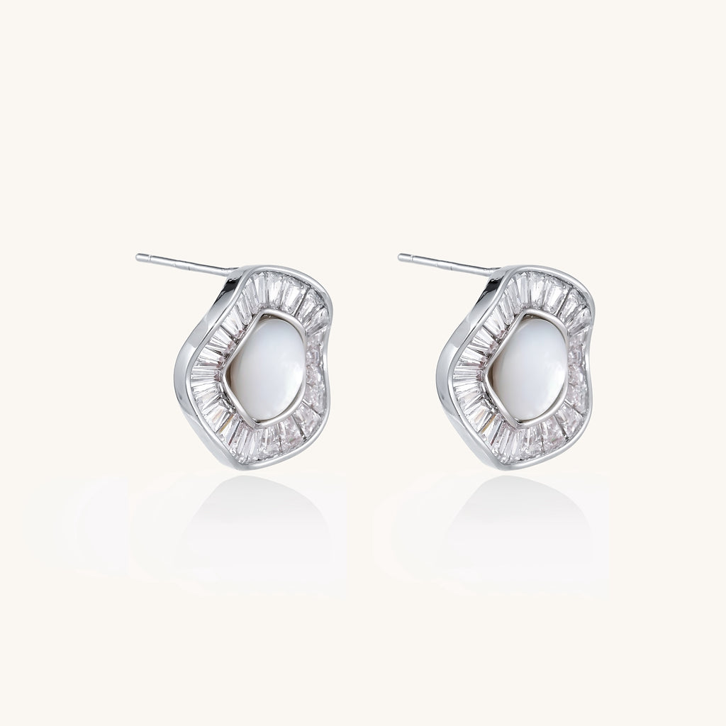 Gold-plated stud earrings with central freshwater pearl surrounded by baguette crystals in radial pattern