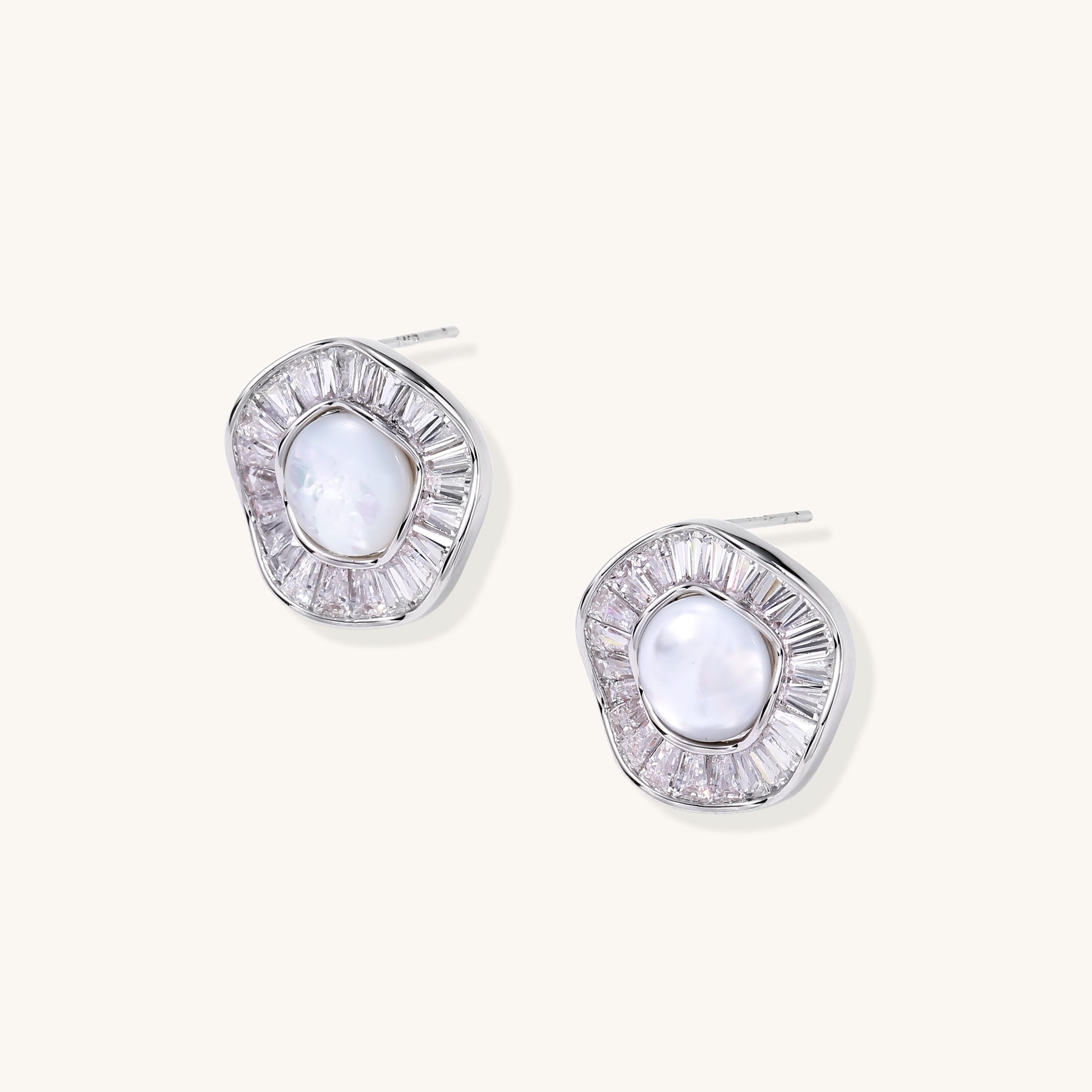 Gold-plated stud earrings with central freshwater pearl surrounded by baguette crystals in radial pattern