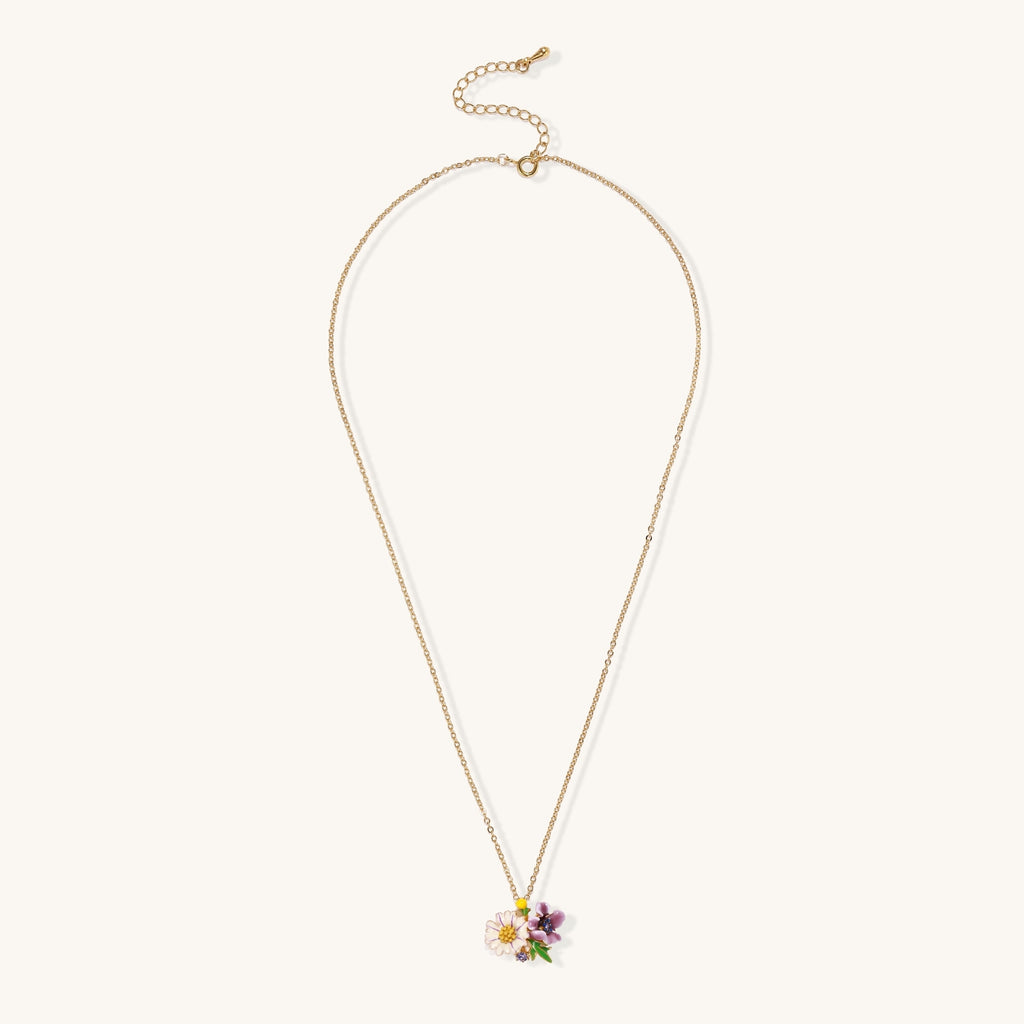 Delicate 18K gold plated necklace featuring colorful enamel flowers in pink and white with green leaves on chain